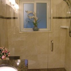 Frameless shower door with in-line panel