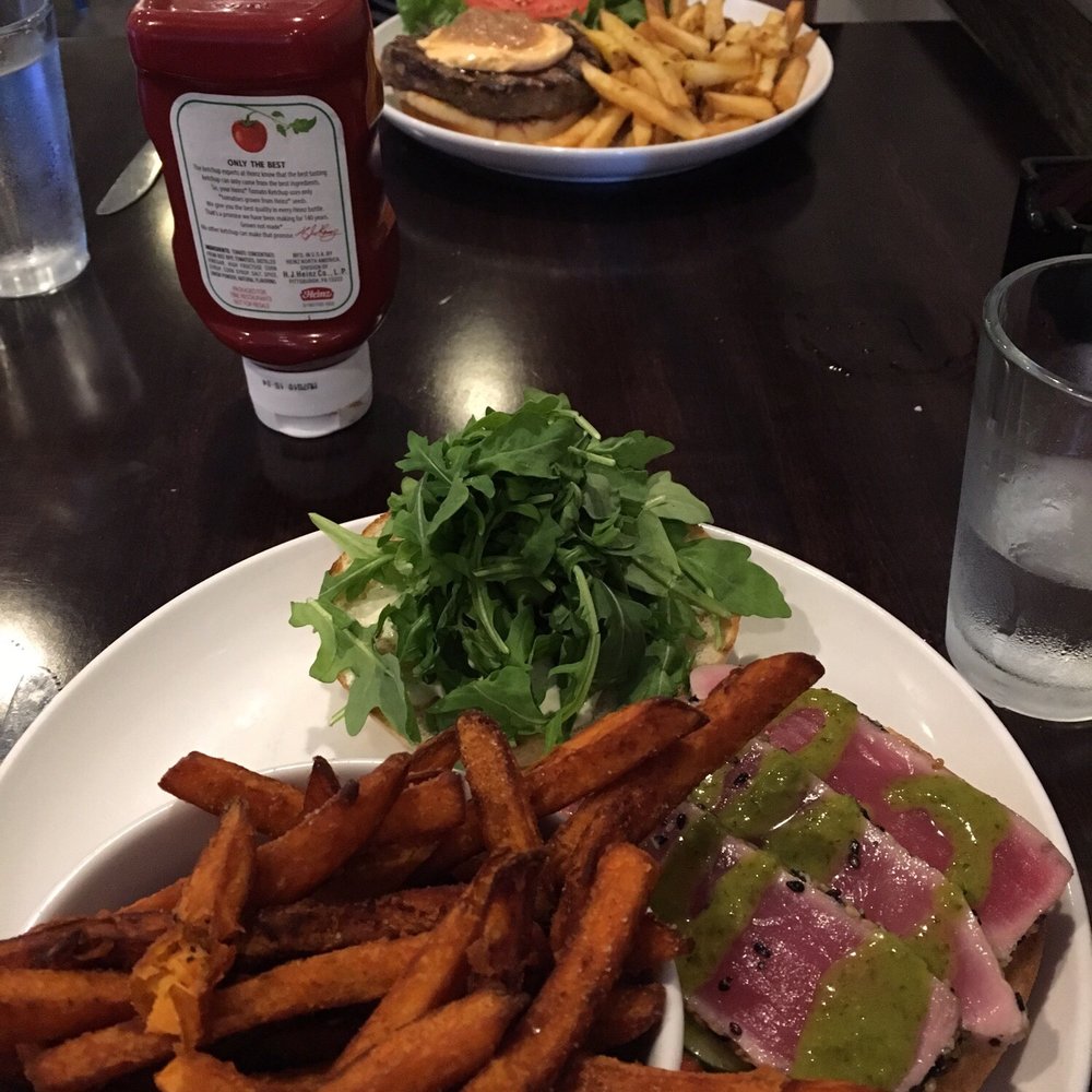 Dilly. Bistro, Bar & Bottle Shop - Ahi tuna sandwich with sweet potato fries, and a burger in the back - New American Near Me - Cincinnati, Ohio Dilly. Bistro, Bar & Bottle Shop - Ahi tuna sandwich with sweet potato fries, and a burger in the back - New American Near Me - Cincinnati, Ohio