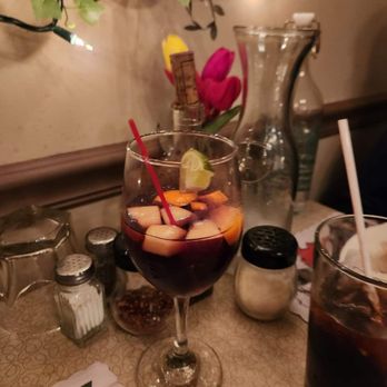 Bacchanalia Ristorante - a glass of red wine with a slice of lime - Italian Near Me - Chicago, Illinois Bacchanalia Ristorante - a glass of red wine with a slice of lime - Italian Near Me - Chicago, Illinois