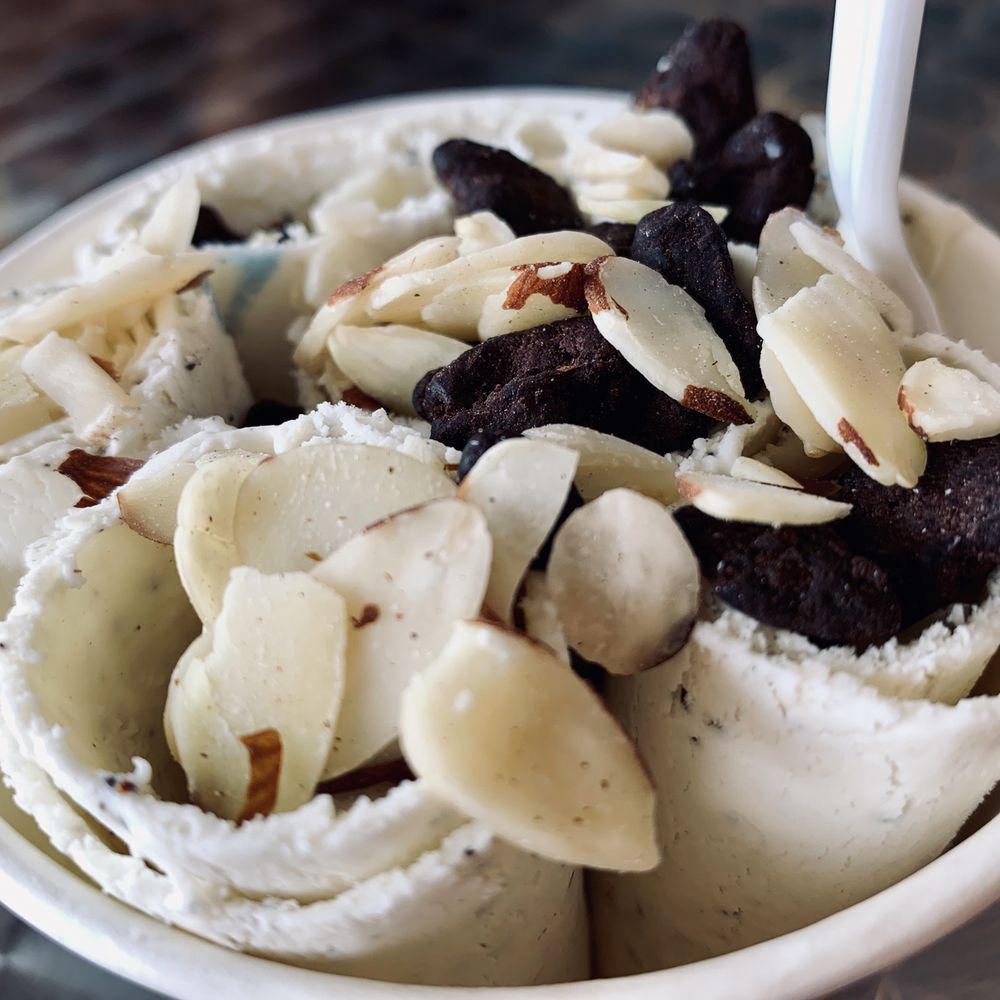 Rolling Ice - Coffee ice cream topped with almonds and brownie bits - Ice Cream & Frozen Yogurt Near Me - Arlington, Texas Rolling Ice - Coffee ice cream topped with almonds and brownie bits - Ice Cream & Frozen Yogurt Near Me - Arlington, Texas