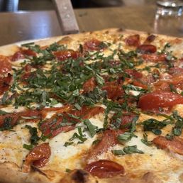 Make your own Pizza with pepperoni tomatoes and basil Make your own Pizza with pepperoni tomatoes and basil