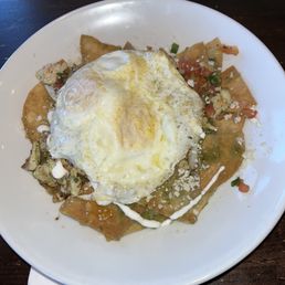 Chilaquiles with over medium eggs & grilled chicken Chilaquiles with over medium eggs & grilled chicken
