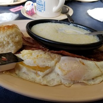 Henry's Uptown Cafe - Two eggs easy over, country grits, bacon, biscuits. - American Near Me - Rockingham, North Carolina Henry's Uptown Cafe - Two eggs easy over, country grits, bacon, biscuits. - American Near Me - Rockingham, North Carolina