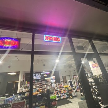 The Austinite Market - Harmon Ave - Open sign, clearly still on because it is before midnight - Convenience Stores Near Me - Austin, Texas The Austinite Market - Harmon Ave - Open sign, clearly still on because it is before midnight - Convenience Stores Near Me - Austin, Texas