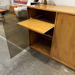Pictured is a sliding shelf in the piece I looked at. Pictured is a sliding shelf in the piece I looked at.