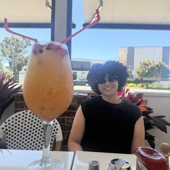 Serendipity Restaurant - My head compared to large mimosa - Sports Bars Near Me - Redondo Beach, California Serendipity Restaurant - My head compared to large mimosa - Sports Bars Near Me - Redondo Beach, California