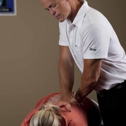 Ascent Chiropractic - Dr. Daryl Marshall-Inman relaxing the back before palpating for an adjustment.