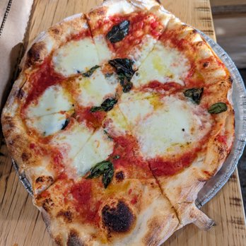 Pizzeria Mercato - Margherita pizza. $14. Tomato, fior di latte, basil, EVOO. - Pizza Near Me - Carrboro, North Carolina Pizzeria Mercato - Margherita pizza. $14. Tomato, fior di latte, basil, EVOO. - Pizza Near Me - Carrboro, North Carolina