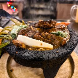 Què Pasa Mexican Cafe - Molcajete combo with chicken, steak.