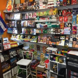 Jano Mart - Behind the counter: Ethiopian DVDs/CDs, Cigarettes, phone cards, and Central American flags. Very unique market.