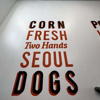 Two hands Corn Dogs -Kennesaw -  a sign on the wall - Fast Food Near Me - Kennesaw, Georgia