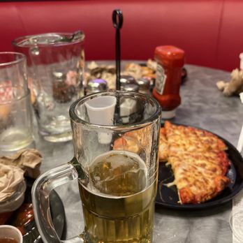 Shakey's Pizza Parlor - a glass of beer on a table - Pizza Near Me - Upland, California Shakey's Pizza Parlor - a glass of beer on a table - Pizza Near Me - Upland, California