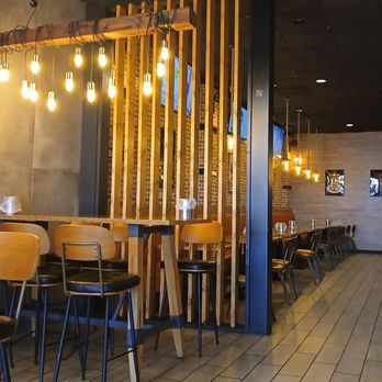 Pelicana Chicken - Interior seating. Around 20-24 tables including the bar-style seating. - Korean Near Me - San Antonio, Texas Pelicana Chicken - Interior seating. Around 20-24 tables including the bar-style seating. - Korean Near Me - San Antonio, Texas