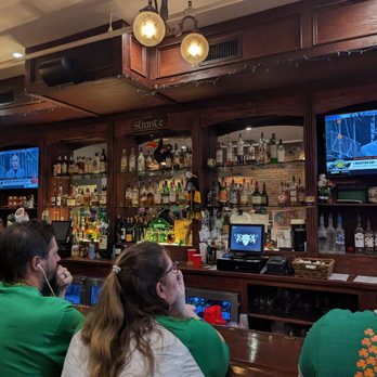 Sullivan's Public House - people sitting at a bar watching tv - Irish Near Me - Oxford, Michigan
