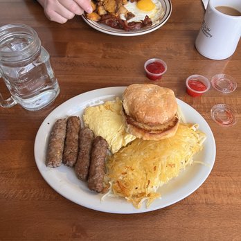 Wild Huckleberry - 2 eggs and sausage breakfast with a biscuit, and 1 egg and bacon breakfast with sourdough bread - Breakfast & Brunch Near Me - Wenatchee, Washington