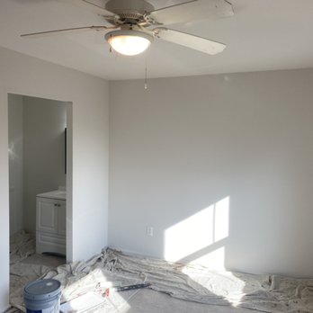 Deck Wonders - an empty room with a ceiling fan - Painters Near Me - Gaithersburg, Maryland