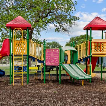 Sunset Heights - a colorful playground with slides and climbers - Apartments Near Me - San Antonio, Texas Sunset Heights - a colorful playground with slides and climbers - Apartments Near Me - San Antonio, Texas