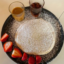 Life Garden Cafe - Gluten-free pancakes served with maple syrup and caramel sauce
