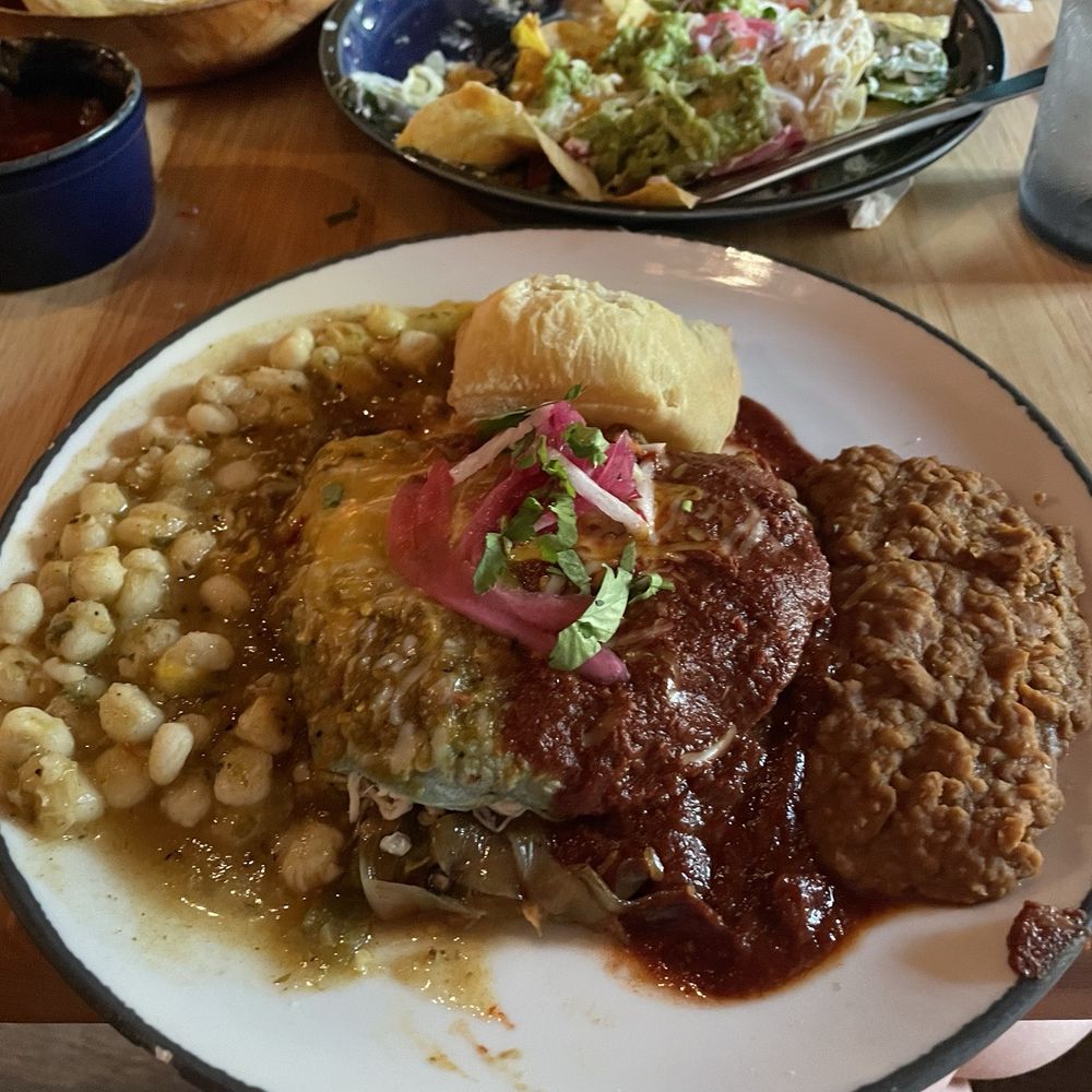 El Coyote - Chicken Enchiladas served Christmas style, refried beans and posole - New Mexican Cuisine Near Me - Oklahoma City, Oklahoma El Coyote - Chicken Enchiladas served Christmas style, refried beans and posole - New Mexican Cuisine Near Me - Oklahoma City, Oklahoma