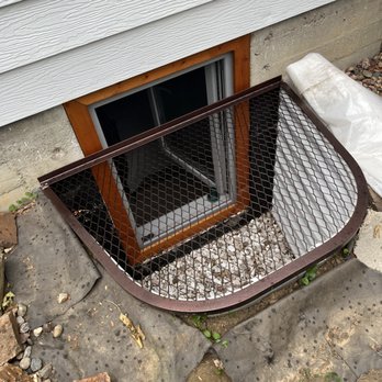 US Egress - Custom Exterior Finish with Treated Cherry Wood - Windows Installation Near Me US Egress - Custom Exterior Finish with Treated Cherry Wood - Windows Installation Near Me