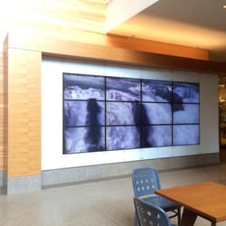Photo of Swedish Issaquah Campus - Issaquah, WA, US. TV "mural wall" with changing pictures of relaxing scenes. The sounds change to match with waterfalls, singing birds, etc.