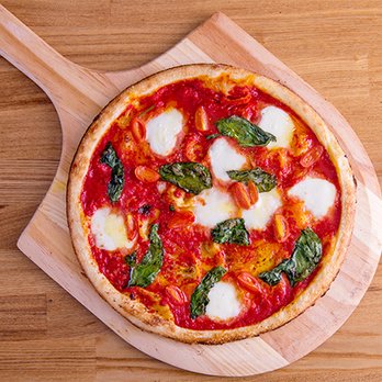 Blaze Pizza - a pizza on a wooden board - Salad Near Me - Charlottetown, Prince Edward Island Blaze Pizza - a pizza on a wooden board - Salad Near Me - Charlottetown, Prince Edward Island