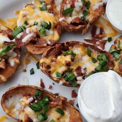 Potato skins with sour cream and ranch