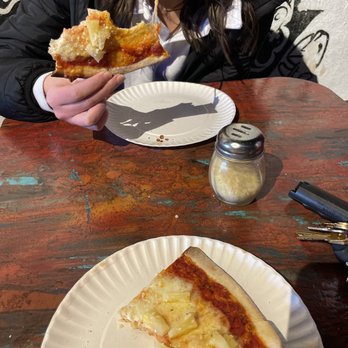 Pie Hole - a woman eating a slice of pizza - Pizza Near Me - Denver, Colorado Pie Hole - a woman eating a slice of pizza - Pizza Near Me - Denver, Colorado