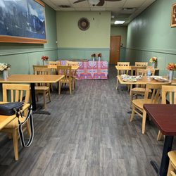 Kandaka - Tables in restaurant. Table full of food was never cleared after an hour.