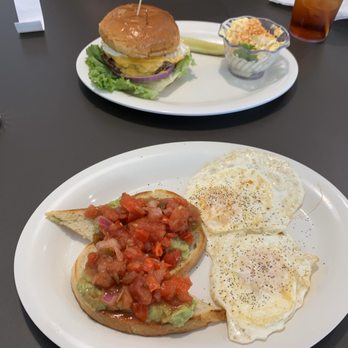 Eggs Up Grill - Cheeseburger with over medium egg and the avacado toast and eggs. - American Near Me - Shallotte, North Carolina
