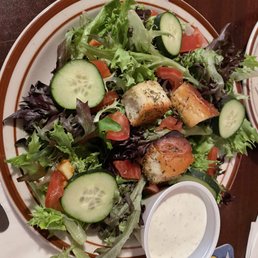 a plate of salad with chicken and cucumbers a plate of salad with chicken and cucumbers