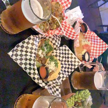 The Den Bar and Grill - Sitting down in tables in the bar enjoying some food, beers, and listening to the live Banda. - Sports Bars Near Me - Hawthorne, California