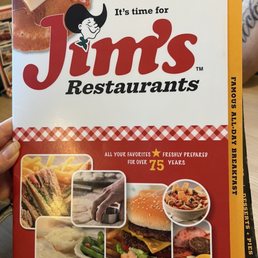 a hand holding a menu a hand holding a menu
