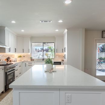 Coast Design & Build Houston - a kitchen with white cabinets and stainless steel appliances - General Contractors Near Me - Houston, Texas Coast Design & Build Houston - a kitchen with white cabinets and stainless steel appliances - General Contractors Near Me - Houston, Texas