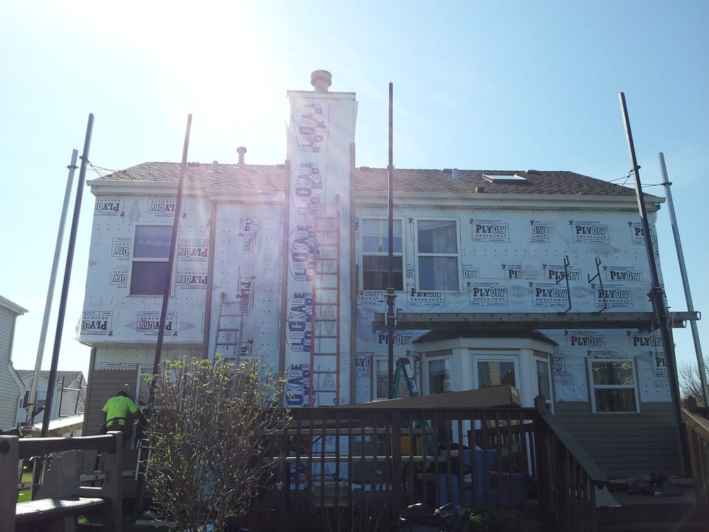 Slide of Manna Roof & Construction