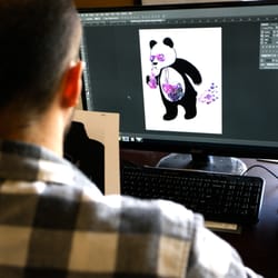 Elosh Clothing Customized Apparel & Screen Print - Chuck is working on the Panda Design on Photoshop