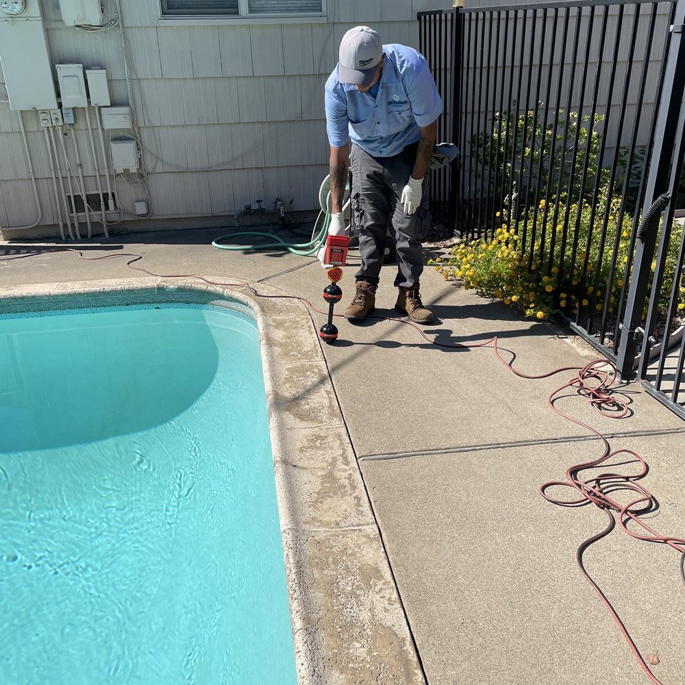 The Plumbing Machines - Proof of root removal and Eric showing where roots were found. Under the deck. - Plumbing Near Me - Sacramento, California The Plumbing Machines - Proof of root removal and Eric showing where roots were found. Under the deck. - Plumbing Near Me - Sacramento, California