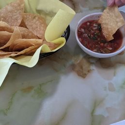 Chips and salsa. (Action shot) Chips and salsa. (Action shot)