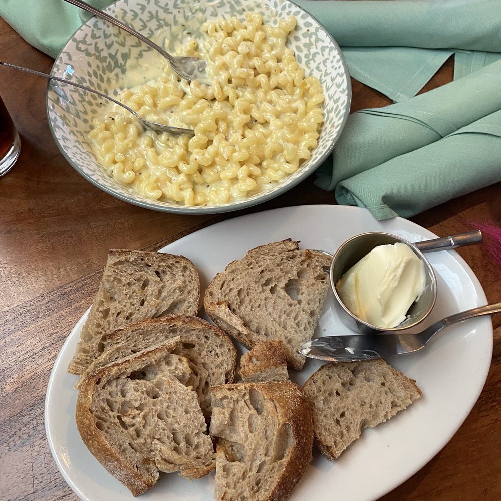 Nosh Eatery - The WORLD'S BEST MAC & CHEESE with a side of fresh warm bread and butter. - New American Near Me - Florence, Oregon Nosh Eatery - The WORLD'S BEST MAC & CHEESE with a side of fresh warm bread and butter. - New American Near Me - Florence, Oregon