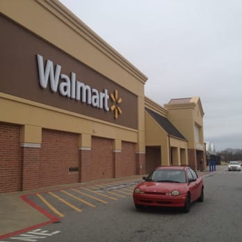 Walmart Supercenter - a red car parked in front of the store - Department Stores Near Me - Madison, Georgia