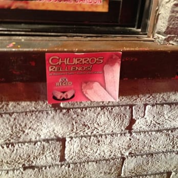 Pollo Regio - a sign on a brick wall - Chicken Shop Near Me - Dallas, Texas