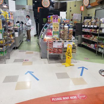 H Mart - Diamond Bar - How are customers supposed to see this tape on the ground when it's busy? Avoid confusion by having a normal line system... - Grocery Near Me - Diamond Bar, California