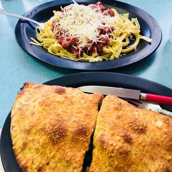 R Pizza Place - two plates of food on a table - Pizza Near Me - Castle Dale, Utah R Pizza Place - two plates of food on a table - Pizza Near Me - Castle Dale, Utah