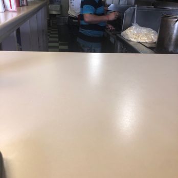 Rhea's 2 - The employees cooking great food. - Burgers Near Me - Roswell, Georgia Rhea's 2 - The employees cooking great food. - Burgers Near Me - Roswell, Georgia