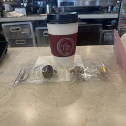 Fresh coffee with a side of chocolate