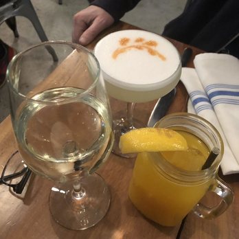 Limón - Our drinks: a glass of wine, a Pisco sour, and a mango lemonade for the little one - Peruvian Near Me - Oakland, California