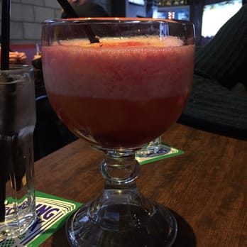 1st RND - Bellini - contains white rum, peach schnapps, raspberry schnapps, and is topped with peach slush. - Sports Bars Near Me - Edmonton, Alberta 1st RND - Bellini - contains white rum, peach schnapps, raspberry schnapps, and is topped with peach slush. - Sports Bars Near Me - Edmonton, Alberta