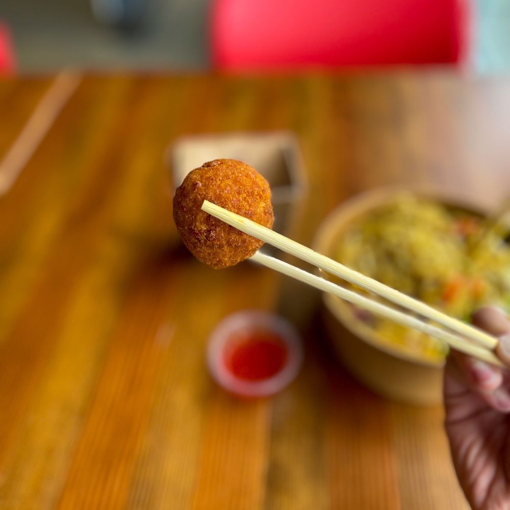 Noodlebox - a person holding chopsticks over a bowl of food - Noodles Near Me - Edmonton, Alberta Noodlebox - a person holding chopsticks over a bowl of food - Noodles Near Me - Edmonton, Alberta