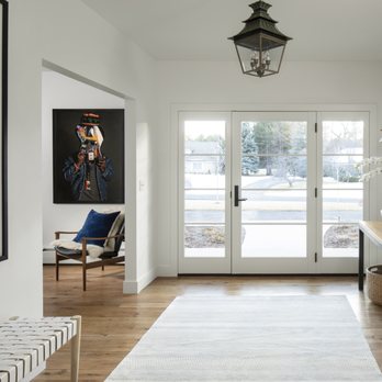 Factor Design Build - a hallway with white walls and a white rug - General Contractors Near Me - Denver, Colorado Factor Design Build - a hallway with white walls and a white rug - General Contractors Near Me - Denver, Colorado
