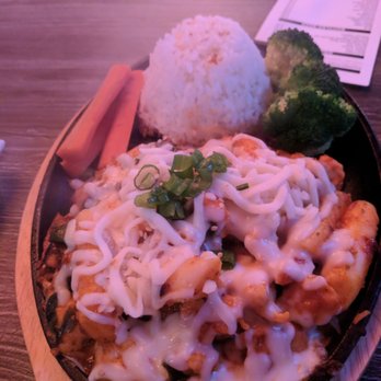 Bonchon - Bull Dak - chicken, rice cakes, smothered in spicy sauce and cheese with rice. - Chicken Wings Near Me - Orlando, Florida Bonchon - Bull Dak - chicken, rice cakes, smothered in spicy sauce and cheese with rice. - Chicken Wings Near Me - Orlando, Florida